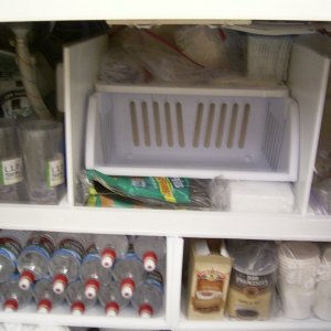 After 4 years, I gave the boat a birthday present-- shelving under the sink/stove counter