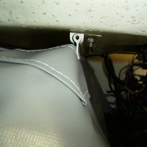 The top is attached with the slider and the bottom and sides are snaps.