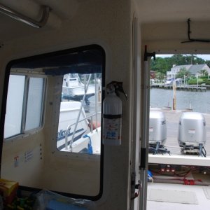 Media 'Second interior fire extinguisher by WALLAS stove. View includes door and first extinguisher.' in album 'Toys are all in: Raymarine 4KW radar w/ C80 display, Garmin 2006C w/fish finder , ST6001 Autopilot, NAVMAN 3100 Fuel Flow management system, ICOM M502 VHF and Standard Signaler/Hailer. Love those toys; especially the radar chart overlay & fuel management system.'