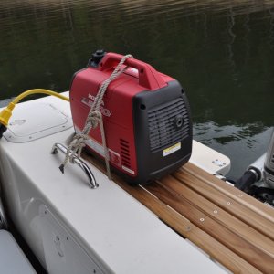 Generator secured on shelf.  Plenty of room left for BBQ