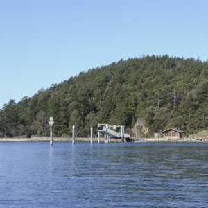 A mostly empty Fossil Bay, Sucia Island. Inner Dock #2 not yet returned for the season.