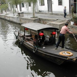 Media '(rogerbum) Dory in Zhujiajiao (a village 30 miles outside of Shanghai).  I estimate that's a 1/4 horse outboard...' in album '(rogerbum) Releasing of the Fish Bridge in Zhujiajiao.'