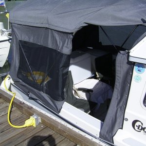 The side panel folds back and the top folds under for easy access at the dock. Both sides are the same.