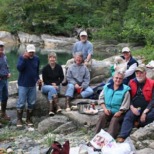 The motly crew gathered on the beach minus Robin taking the photo.
Left to right: Dave (Becky Ann?), Jim (Coho), Mark and Rosalyn (ShiRoz), Caroline and Tom (Bidarka), Signe and Denny (Shade Tree), Becky and Zoie (Becky Ann?).