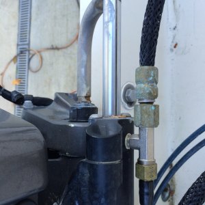 Hydraulic line from DC pump enters the port side of hydraulic piston.