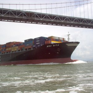 Container ship under Bay Bridge near Treasure Island