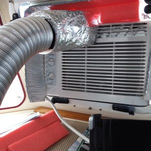How to cool the v-berth area?  The small Frigidaire AC is place into the center opening window.  I then made a funnel cover that fits over 1 side of the AC.   It literally snaps on using 2 magnets.   Holds fine and I then slide on the hose that runs into the v-berth.   The air blows in quite strong and nicely cools down the forward cabin while the other side of the AC unit is still cooling the main cabin.