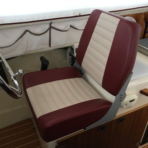 New custom helm seat from Bentley?s Mfg in Portland, OR.  This is their ?large? Sport Deluxe.  Well made, comfortable with good support, and easy to install.     It is soooo much better than the original seat!!!