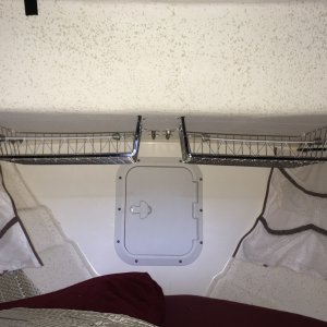 These 2 stainless racks are smaller but will be used for the same purpose as the others.  These split the anchor well door.  They do not impair access to the well and the door still fully opens.