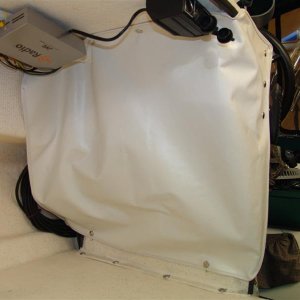 Vinyl with trim and snaps. Got the idea from a bigger C-Dory.