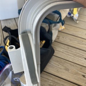 I used butyl tape (two layers in this application) from Sailrite to bed the frame.