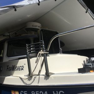 Tied off with a mooring hitch knot so I could access the ladder if I were to fall into the drink single handing!