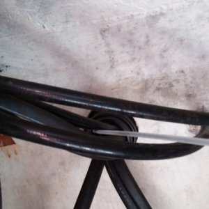 Fishing sensor wires through rigging tubes.  Very tight gasket where rigging tube enters engine (2 part base ring and SS clamp removed). Shift, throttle, gas lines and huge 12 power cords to starter all share this space. Plus maybe some other stuff. This section must be snaked through separately.