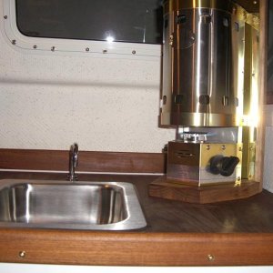 moved sink over screwed wood mount from the bottom and then screwed brass kickplate to mount then cozy to brass kickplate
