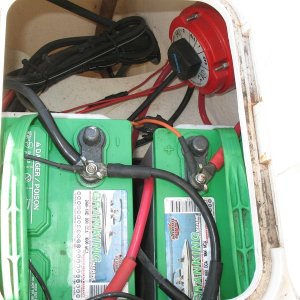 Media 'This photo shows the boat's original batteries (two Group 24 flooded cell batteries) and switch (1-2-Both-All). Many leads going right to battery terminals, no buses, just not very tidy.  Battery trays were screwed right into core, original (leaky) hatch lids, etc.' in album 'Note: Things have changed since this photo; I think I was showing the Weld Mount studs or ?  Leaving it here because it has been linked to in posts.'