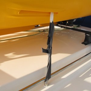 daggerboard webbing tiedown on each side line up well with the roof rails (it is just loop of webbing and the knot at the top keeps it from being pulled down through)