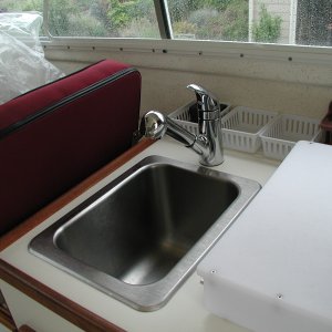 Amazing how happy the First Mate is over this Moen mixer faucet! Less than an hour job.Moen #87315C, possibly discontinued. New Moen model 482086 at Home Depot looks identical and should work.