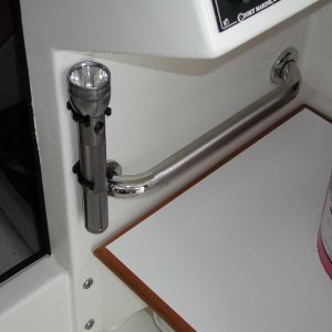 Added Beckson clips for Mag-Lite. Reachable from bed or helm.