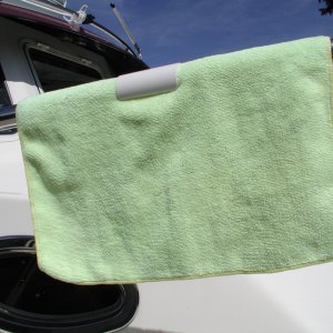 PVC clips snap on 1.25" rails to hold towels for fresh air drying.  Sort of a boater's clothes pin.