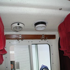To the R. of the light, a Nicro Solar powered exhaust vent. Key to a fresh smelling head! Thanks to Bob of SeaPal for suggestion.