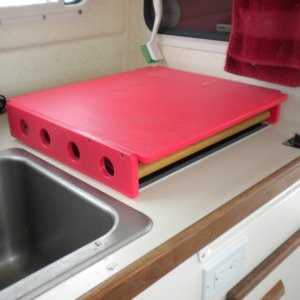 New design cutting board allows the stove to heat boat with cutting board in place.