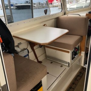 Media 'Port seating was sunbrella cloth.  14 years and kerosene heat and stove took their toll' in album 'Helm seat installed by Bill Perry on Noro Lim.'