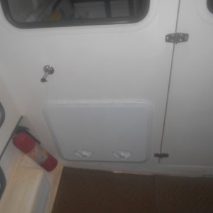 It was either add air conditioning or not sleep on the boat all summer.  Here the unit is stored when not in use.
