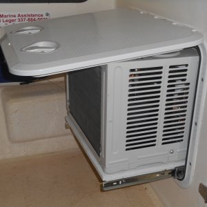 Media 'The unit slides out on rails when in use.  Water drains to the bilge.' in album 'It was either add air conditioning or not sleep on the boat all summer.  Here the unit is stored when not in use.'