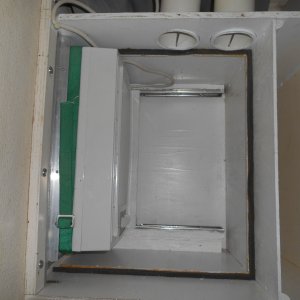 Media 'Unit is extended out for use. Return air enters through louvers in plenum wall, cycles through heat exchanger, and exits through the duct work. (Louvers, backordered, had not yet been installed when this pic was taken.  They would be in the lower wall, midship.)' in album 'It was either add air conditioning or not sleep on the boat all summer.  Here the unit is stored when not in use.'