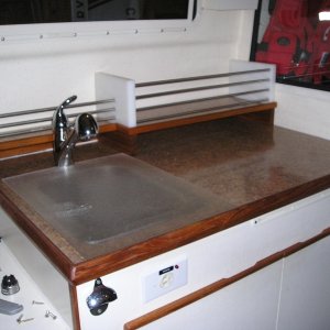 New laminate counter top and raised rack, new faucet
