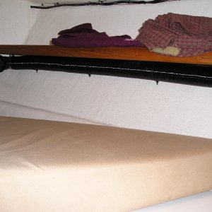 In the V berth the duct runs under the starbd shelf.