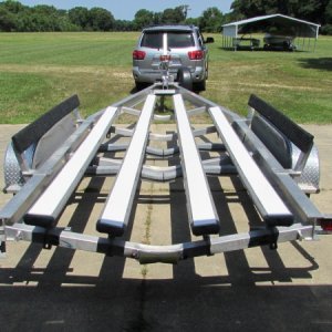 5 x 48 bunk glides from surfix on Amazon.  This mod enabled me to load and unload in shallow water.