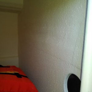 Hole cut between locker & hot water compt allows air flow to stop mildew.