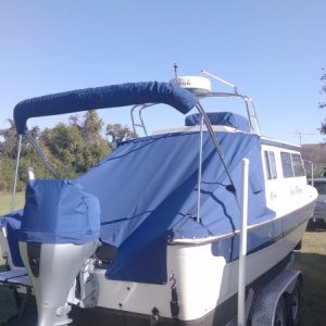 Full aft cover using Sunbrella. Keeping the rain out of the cockpit and leaving the hatches open for ventilation has resulted in a dry bilge. Normally a problem for the CD25...