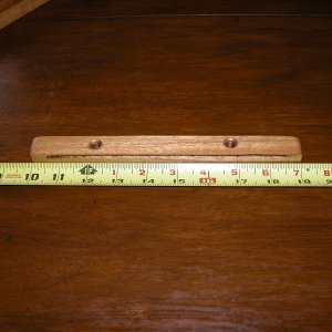 Top slide for ac power panel cover. Made from a 3' piece of 3/4" oak finish stock from Home Depot. Datto is with a Dremel tool router bit set 3/16".