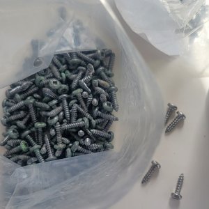 Old window frame screws (green corrosion) getting replaced with new stainless.