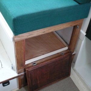I started to build a drawer but did not like the loss of storage space. There is a lot of space in here. The base panel sits inside on little feet that raises it up above the 
T-Track.