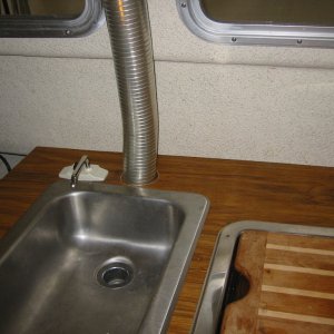 I had to reroute the sink drain to avoid the heater exhaust.(Rock-C)