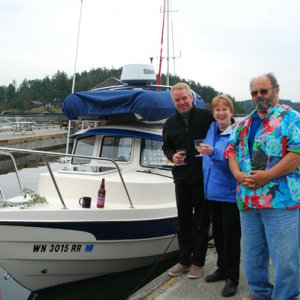 Reverend Jim christens Caiprianha with Paul & Amy