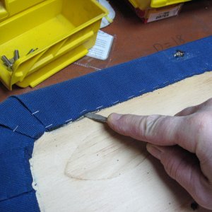 Get under the staples with screwdriver then pull with pliers.