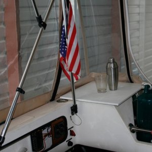 Starboard aft corner. Star board cutting board makes a useful flat surface on the lazarette which is held in place by the corner camperback panel and a grippy piece of rubber under the starboard.