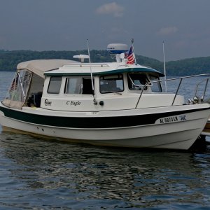 Media 'Guntersville-State-Park-Labor-Day: The Shakespeare Skywatch 2020G antenna is mounted to a SS post at the very rear of the pilot house roof.  This mount provides enough strength to lay an inflable on top of it if needed.' in album 'Shakespeare-TV-Amplifier: I redesigned the bulky mount and made a spacer to flush mount the amplifier box out of the way in front of the copilot seat. This box has a variable gain amplifier and ON OFF switch with LED indicator . When the amp is off, the external tv cable input is routed directly to the TV.'