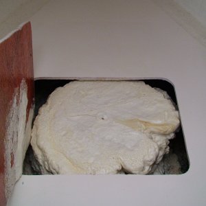Foam under cutout for forward hatch
