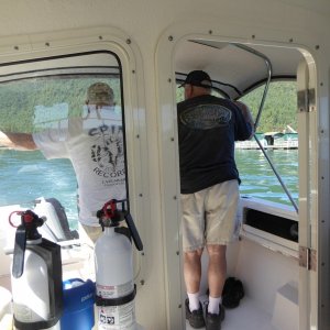 Two of my 3 guests checking out the fish pens at Cypress and the salvage operations.