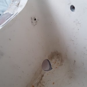 Media 'new holes in each corner' in album 'filled in the old center drain hole'