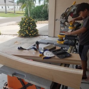 "little man" practices using the orbital on the piece cut off to match the curve of the roof