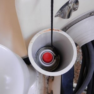 The smaller one fits two butane canisters for the galley stove