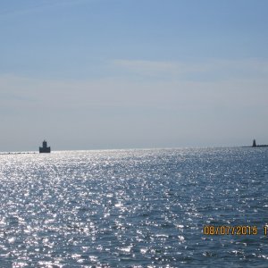 Media 'Harbour entrance - looking out at breakwalls.' in album 'A sailboat with its tender anchored behind the breakwall.'