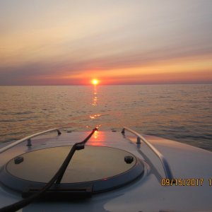 Media 'West Coast Sunset' in album 'A sailboat with its tender anchored behind the breakwall.'
