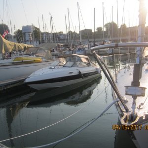 Media 'Kincardin Yacht Club' in album 'A sailboat with its tender anchored behind the breakwall.'